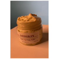 a jar of body butter sitting on a table