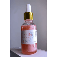 a bottle of oskin rosehip oil serum on a white background